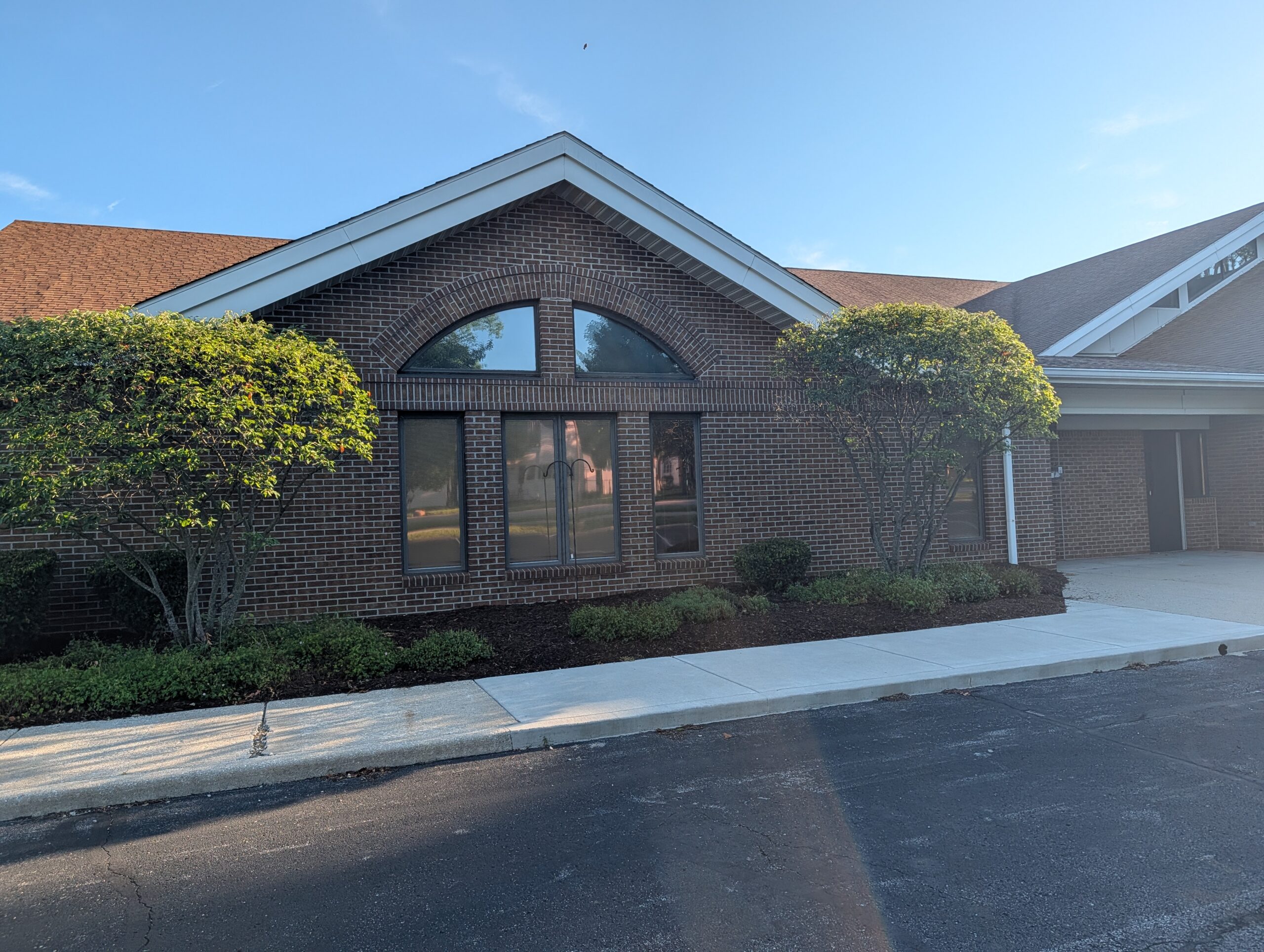 Brick Building Arched Window Landscaping Mooresville Public Library - Exterior Cleaning