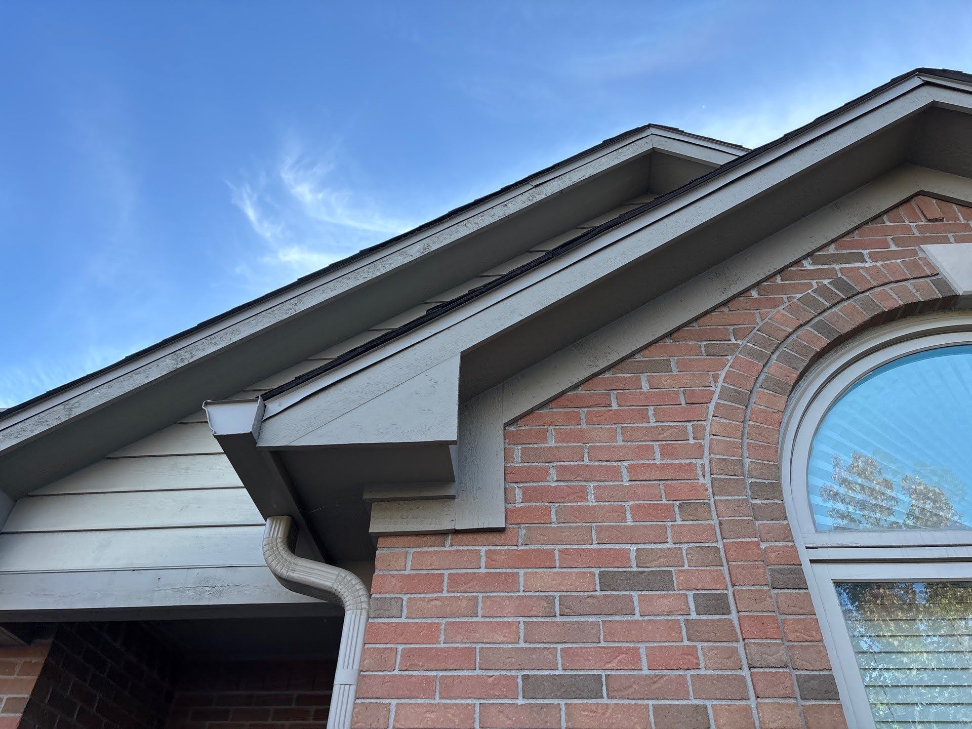 Brick House Eaves Gutter System Lawton Residence exterior: brick wall, gable, and gutter detail.