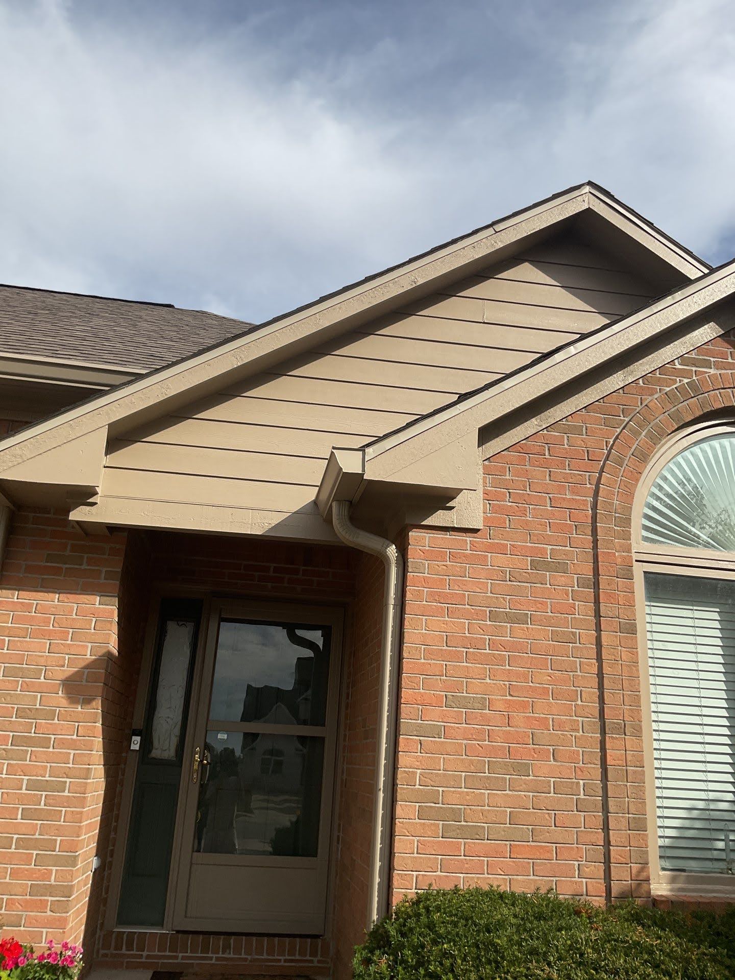 Brick House Tan Siding Gutter System Lawton Residence exterior painting: tan siding and trim on brick house.