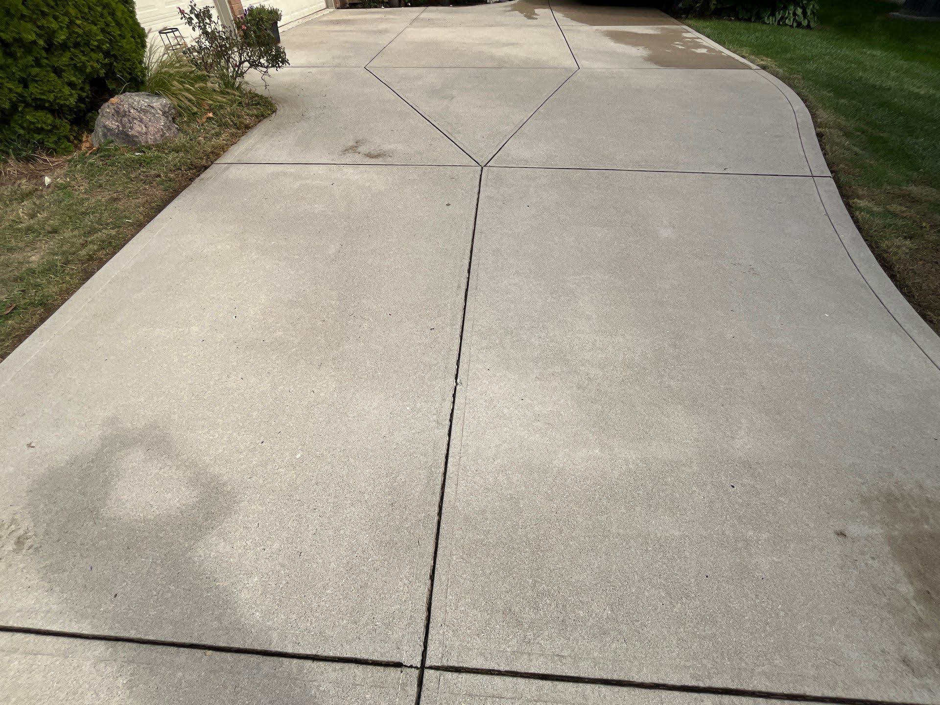 Concrete Driveway Expansion Joints Concrete driveway with expansion joints and water stains