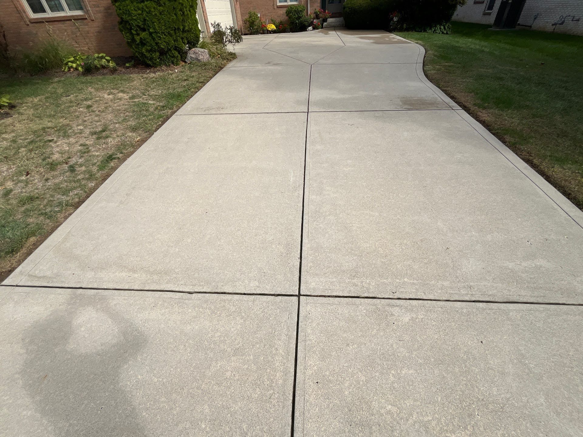 Concrete Driveway With Expansion Joints Concrete driveway at the Lawton Residence, leading to the house.