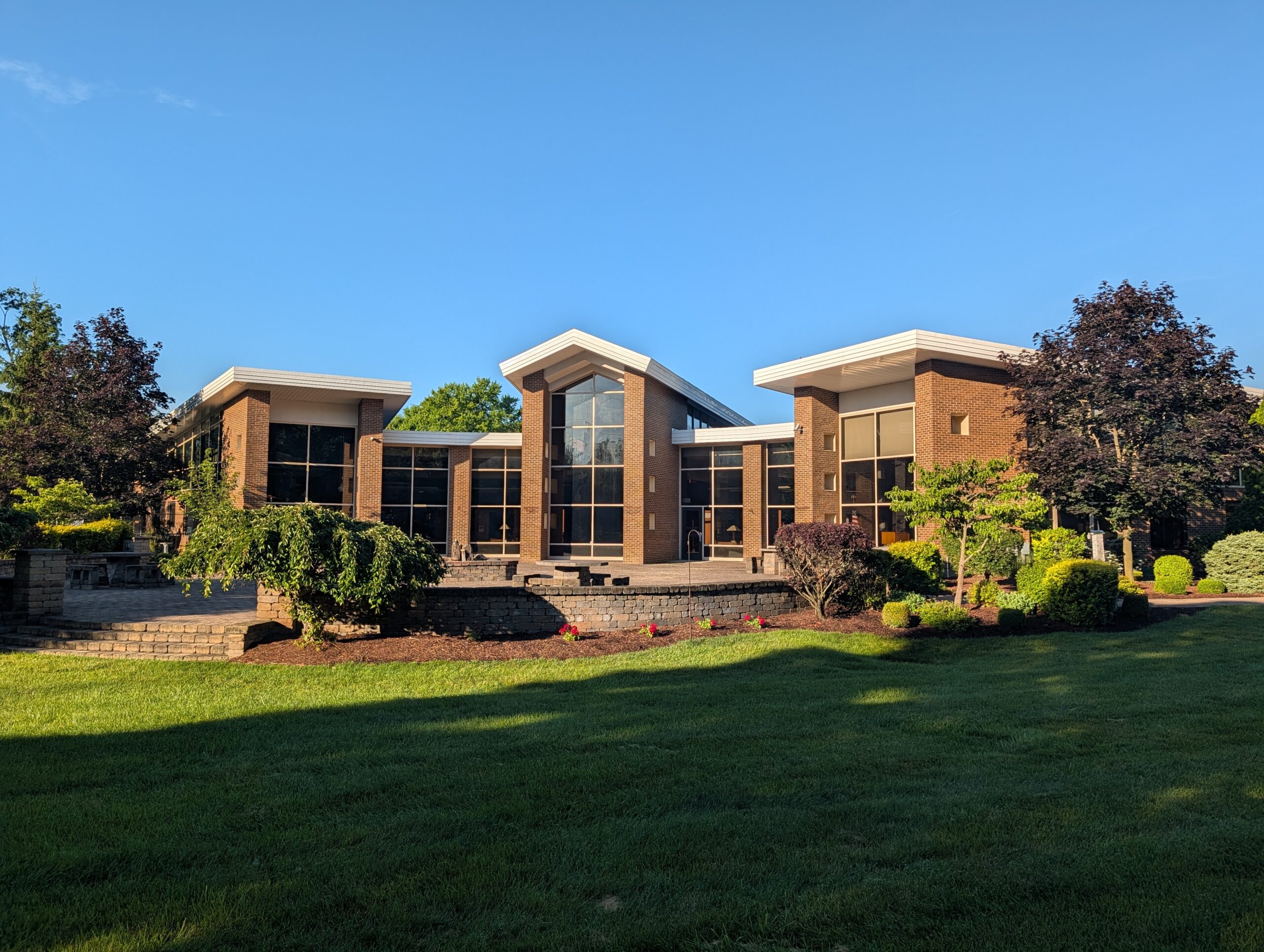 Modern Brick Building With Large Windows And Landscaping Mooresville Public Library - Exterior Cleaning