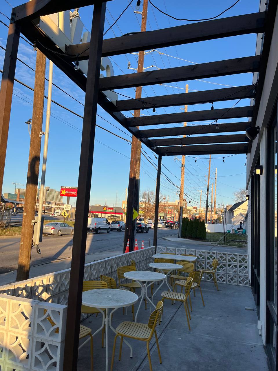 Outdoor Restaurant Seating With Yellow Chairs Cava canopy exterior staining: outdoor dining patio with yellow tables & chairs