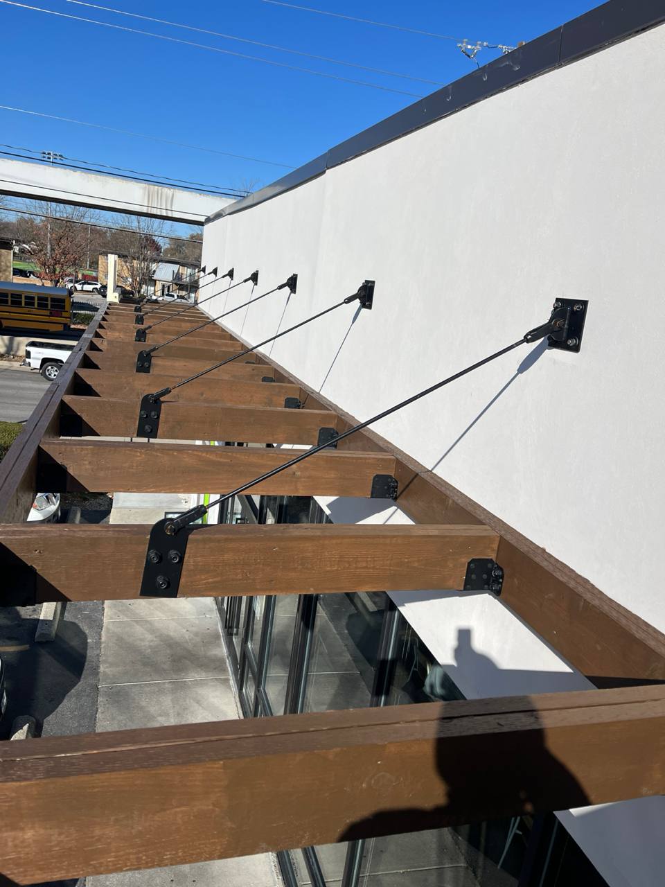Wooden Awning Support Structure Exterior Cava canopy exterior staining: wooden beams and cable supports