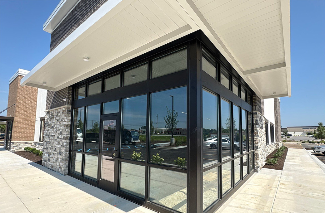 Modern commercial building exterior with brick and stone siding
