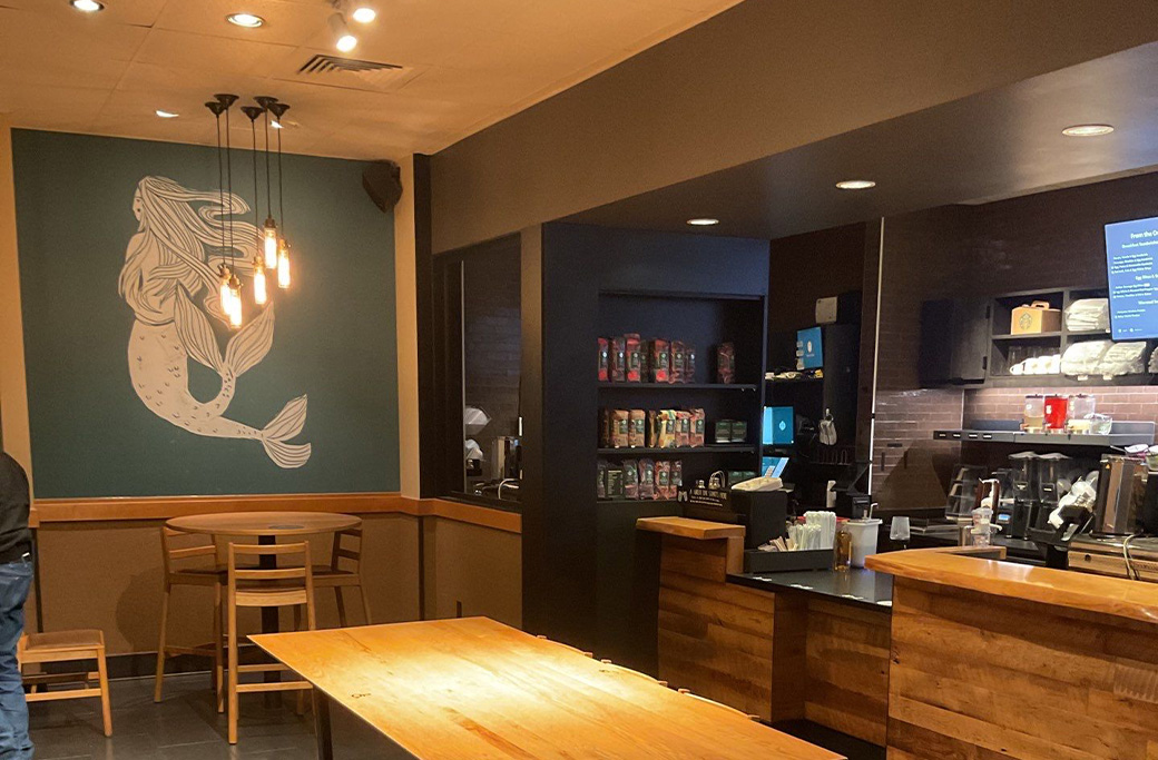 Updated accent walls at a Starbucks location in Indianapolis completed by Indiana Painting Company as part of a commercial interior painting project