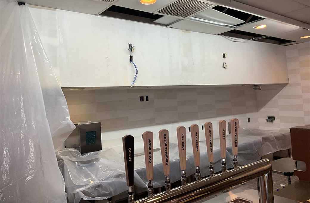 Restaurant equipment protected during a commercial interior painting project in Central Indiana