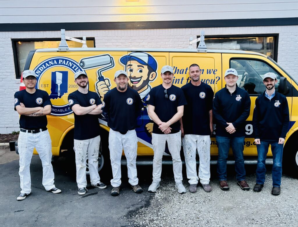 The Indiana Painting team standing in front of the company van in Mooresville, Indiana