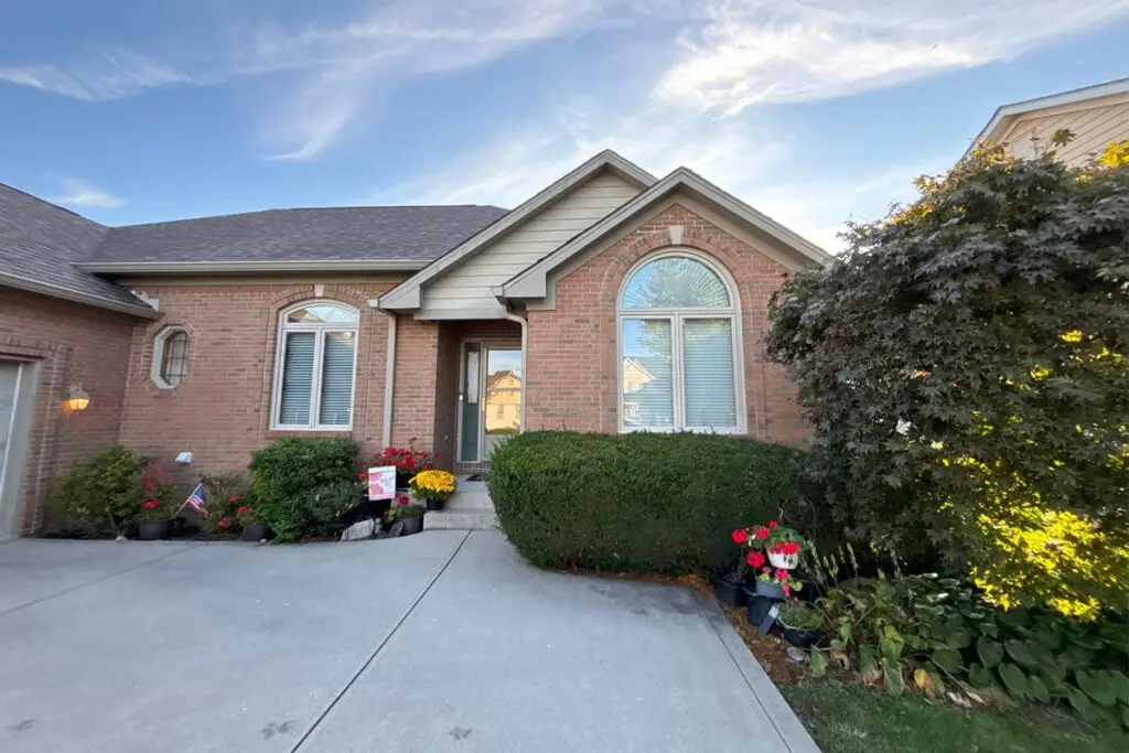 Lawton Residence exterior painting: brick house with arched windows and landscaping